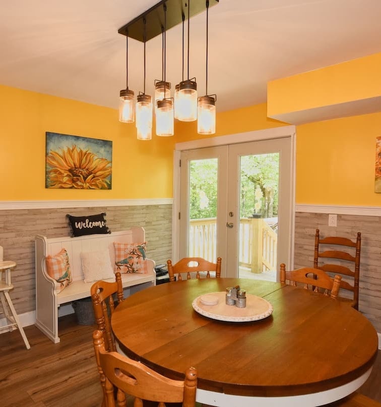 Hawk's Crest Landing I — dining room with mason jar chandelier and French doors