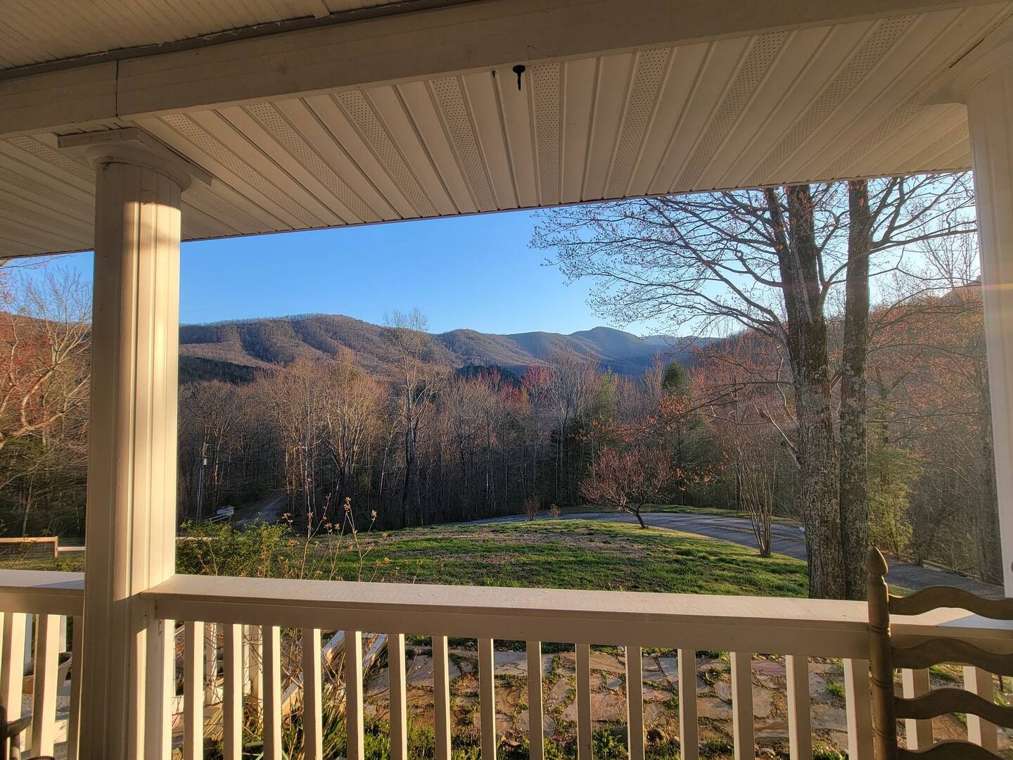 Hawk's Crest Landing I — mountain view framed by white porch columns in fall