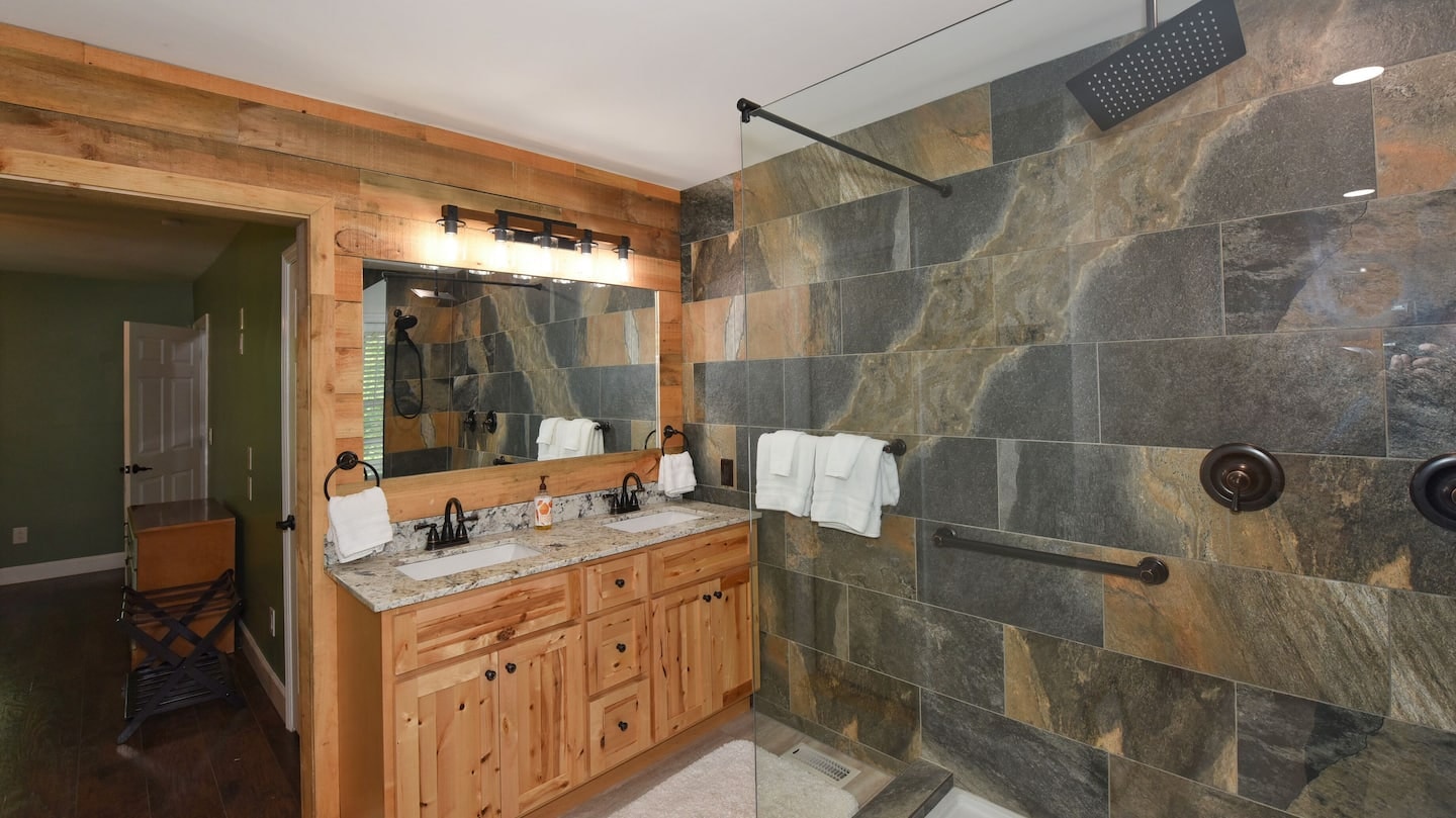Hawk's Crest Landing I — master bathroom double vanity with slate tile shower
