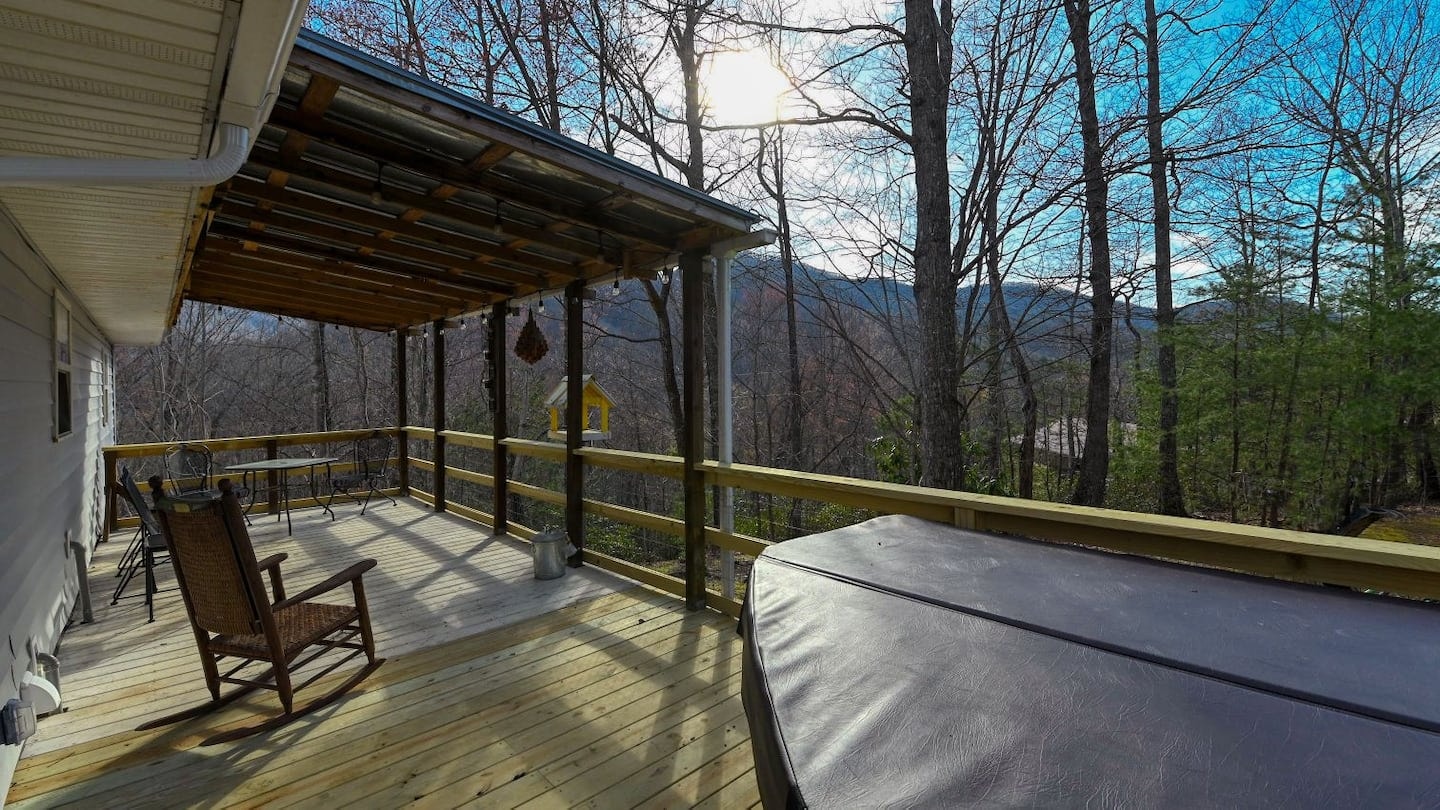 Hawk's Crest Landing II — backyard with hot tub, rocking chair and mountain view