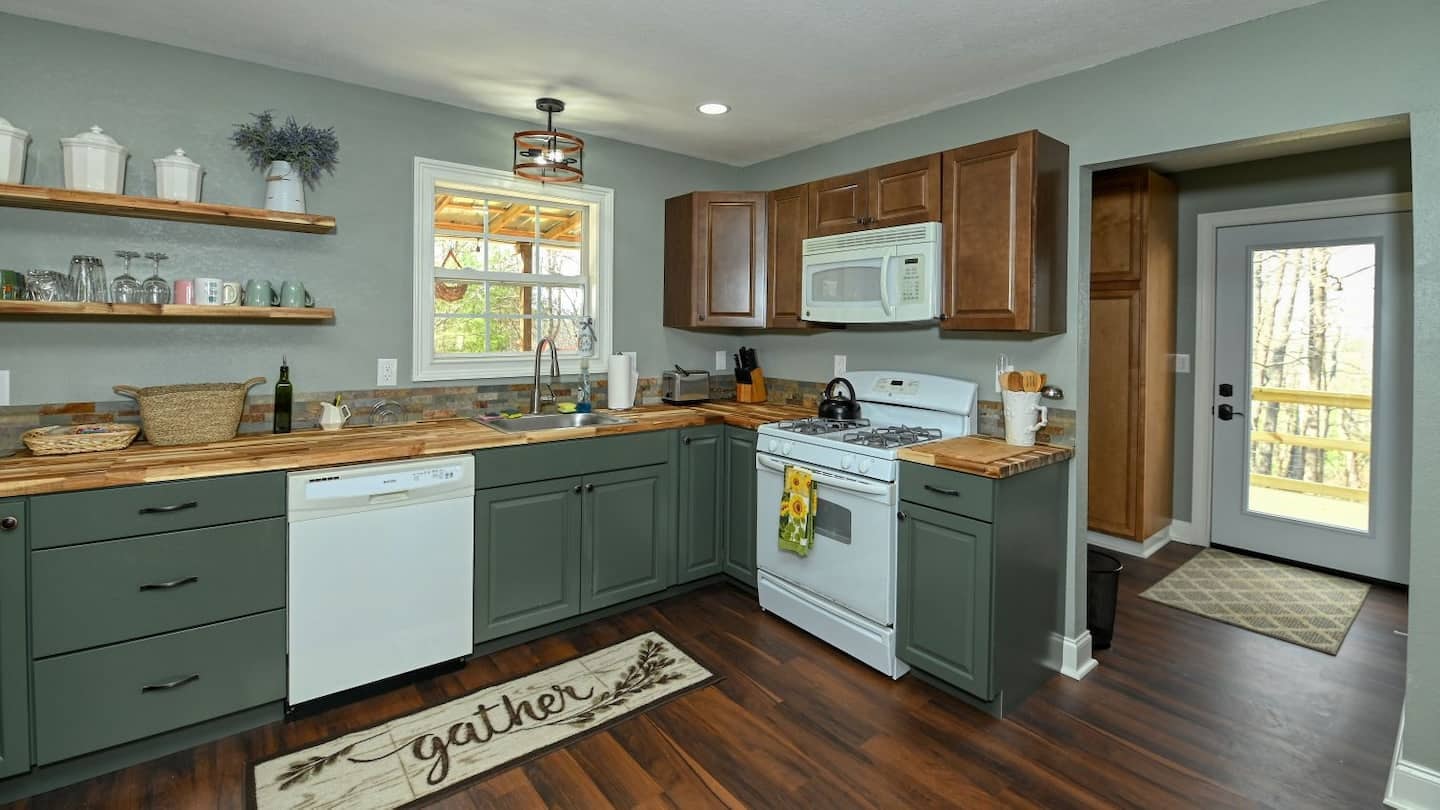 Hawk's Crest Landing II — kitchen with sage green cabinets and butcher block