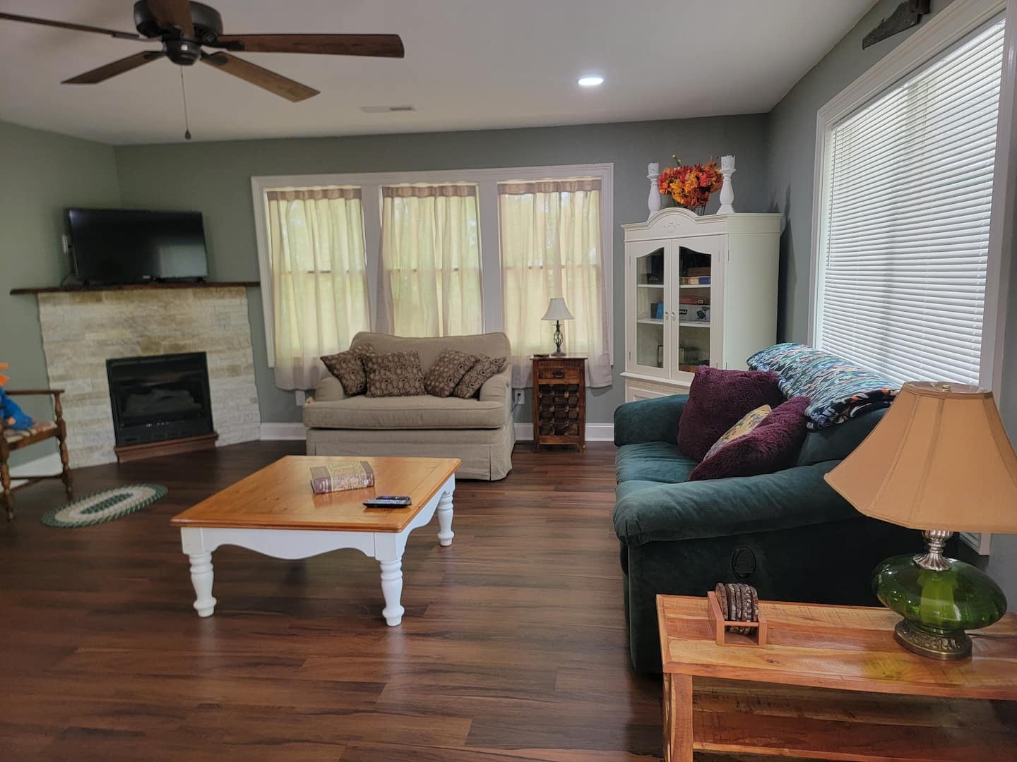 Hawk's Crest Landing II — living room with fireplace and teal sofa